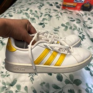 Yellow and white Adidas